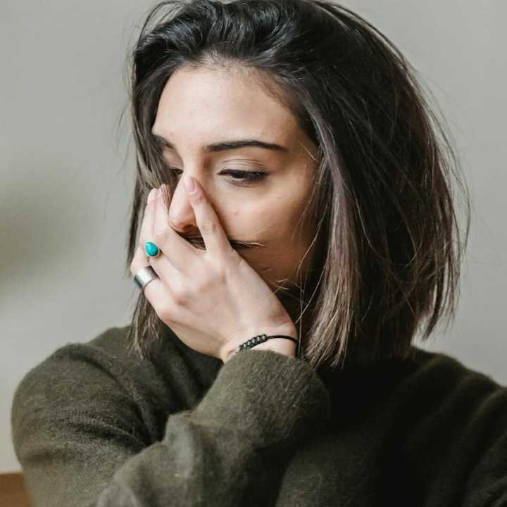 worried girl with her hand over her mouth-liza-summer